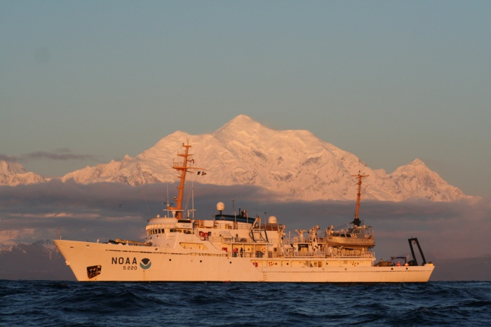 NOAA Ship Fairweather in the Gulf of Alaska, with Mount Fairweather in the background.
