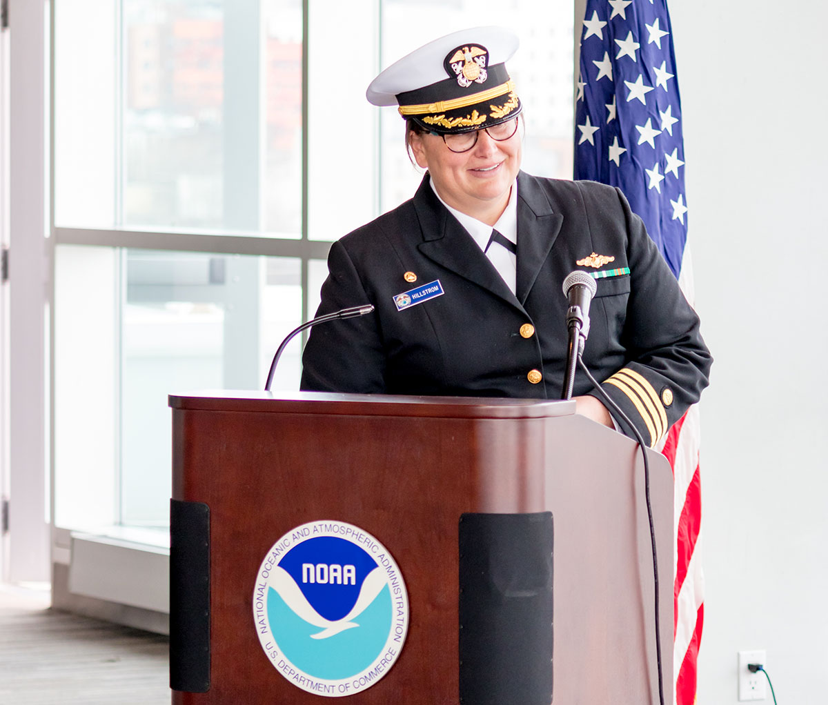 Cmdr. Hillstrom at podium.