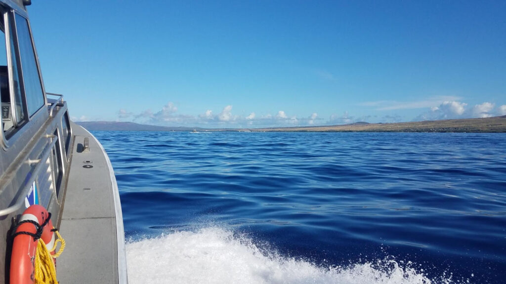 A Rainier hydrographic survey launch transiting between the island of Maui and Molokai.